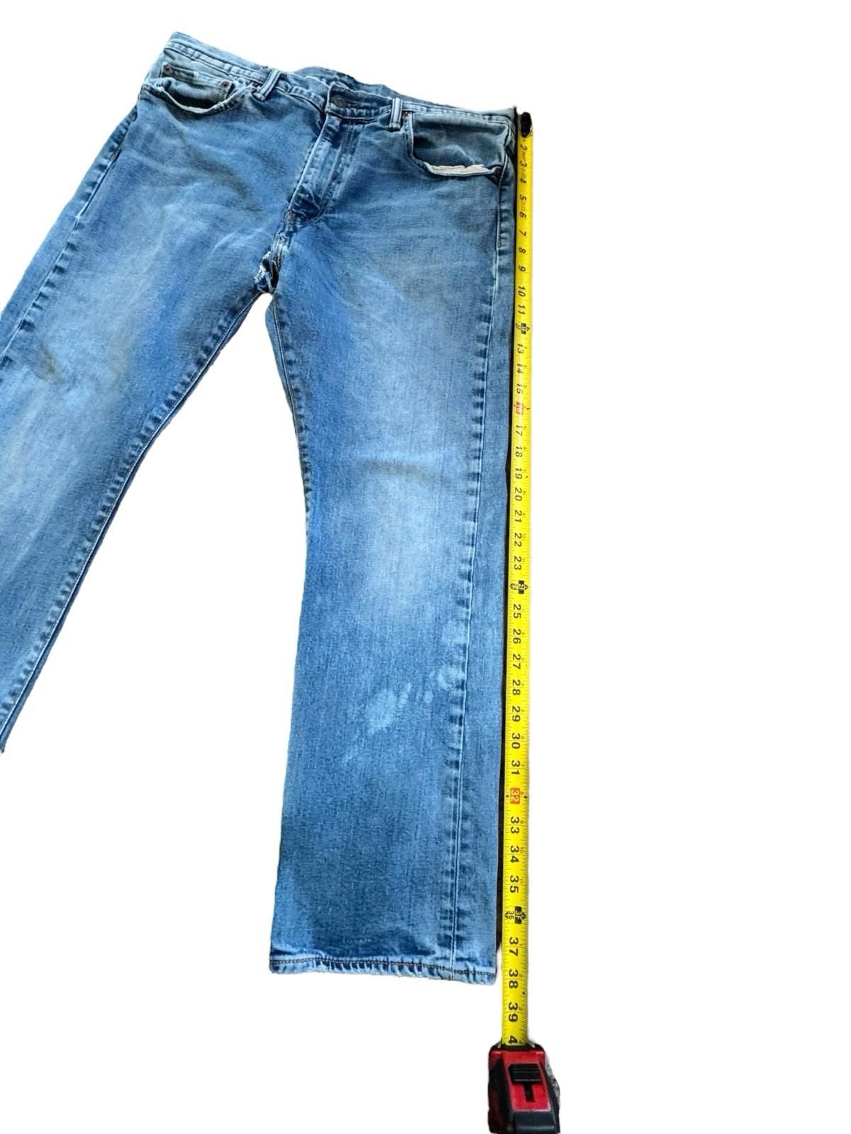 Levis 513 Blue Jeans Size 36 x 30 Denim With Tear
