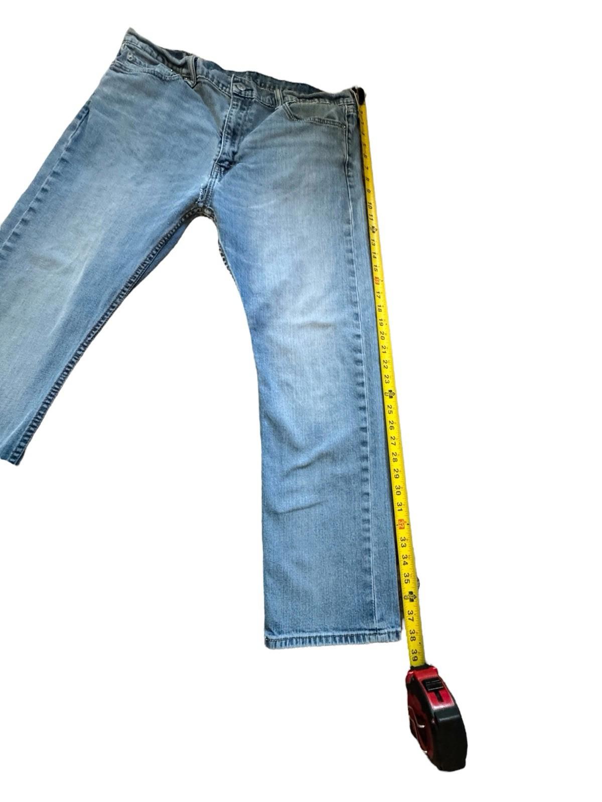 Levis 513 Blue Jeans Size 38 x 30 Denim Well Worn And Soft With Tear